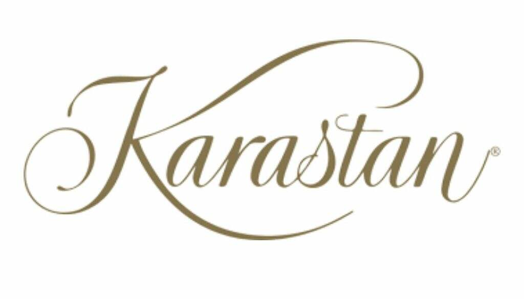 Elegant script logo of Karastan, possibly a brand identity, depicted in a sophisticated and classic typeface.